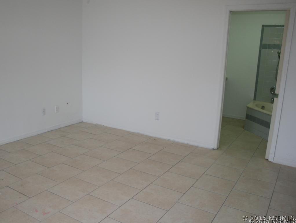 2429 Unity Tree Drive Edgewater, FL 32141 - Photo 10 of 24 an empty room and a bathroom