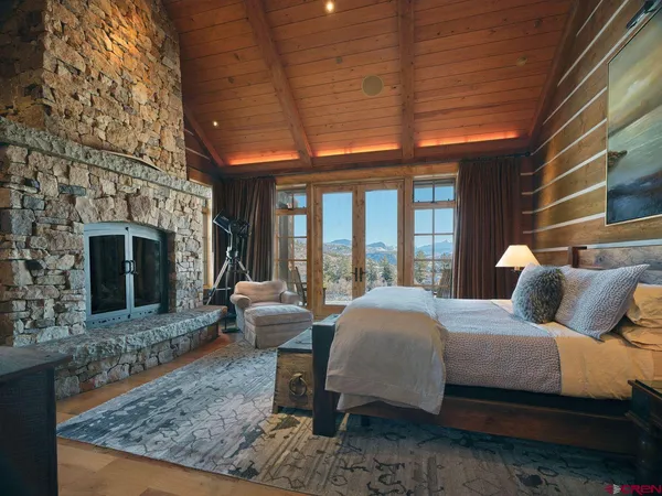 a bedroom with furniture and a window