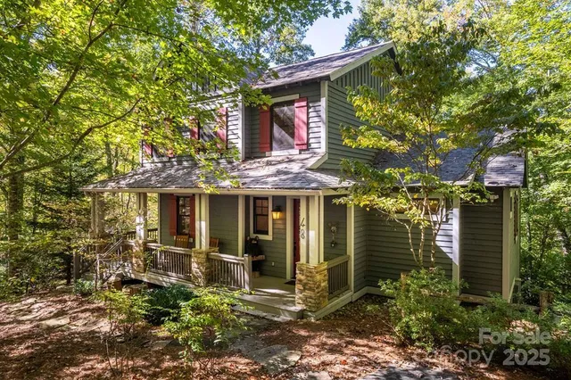 a view of a house with brick walls and potted plants