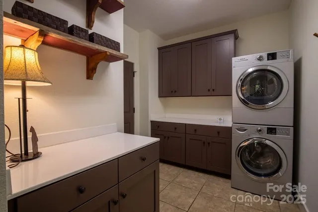 a utility room with sink dryer and washer