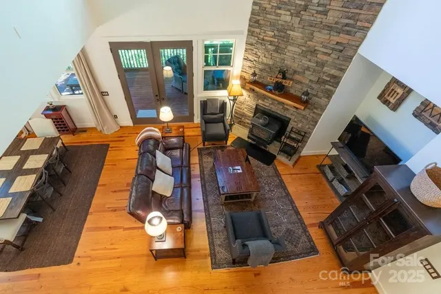 a view of living room with furniture and wooden floor