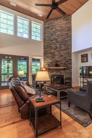 a living room with furniture a fireplace and a table
