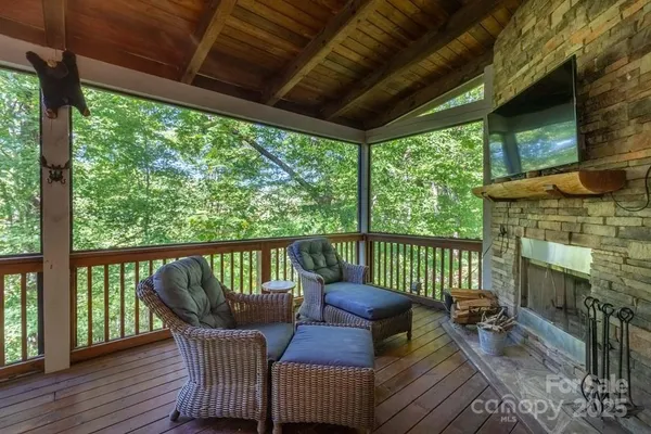 a view of roof deck with furniture