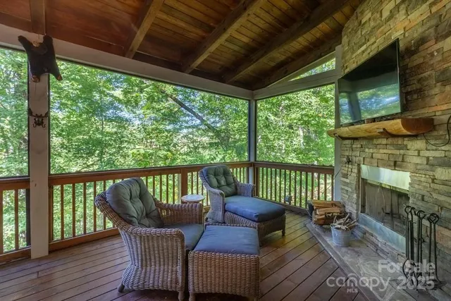 a view of roof deck with furniture