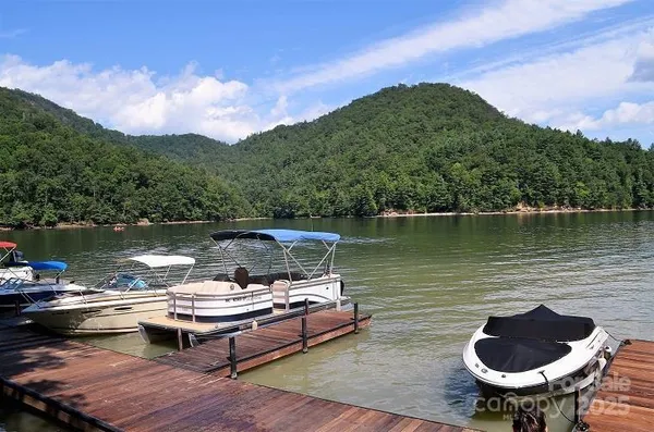 a view of a lake with a table and a chair