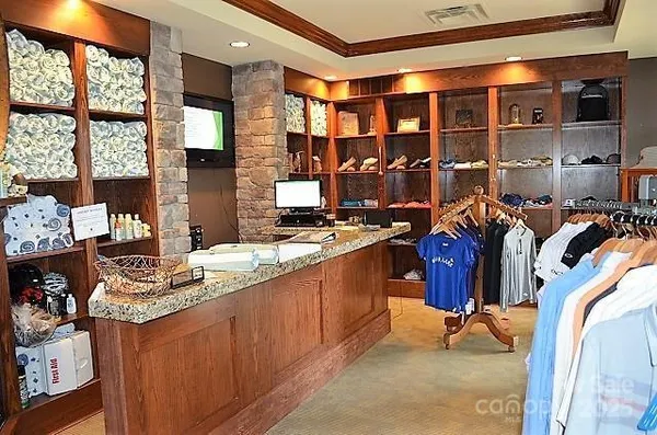 a view of kitchen with stainless steel appliances granite countertop sink stove and cabinets