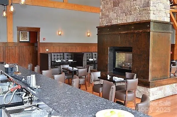 a living room with furniture a rug and a fireplace