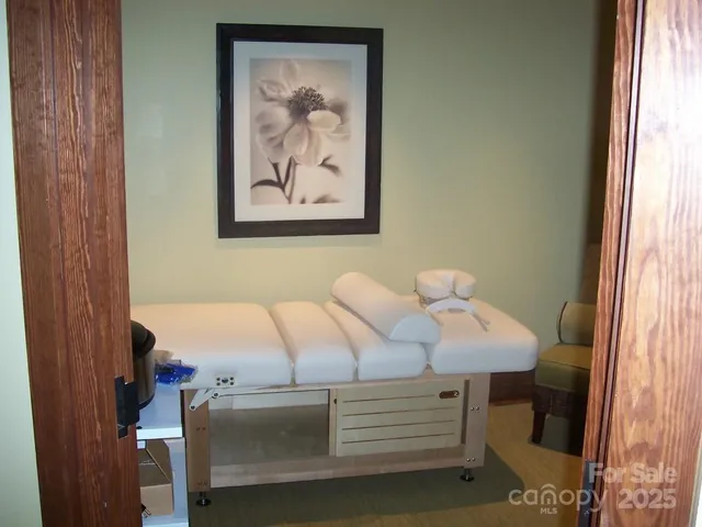 a view of bedroom with furniture and window