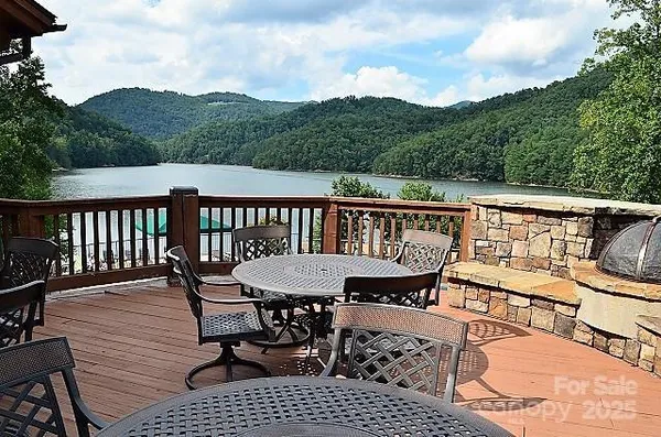a view of a chairs and table on the deck