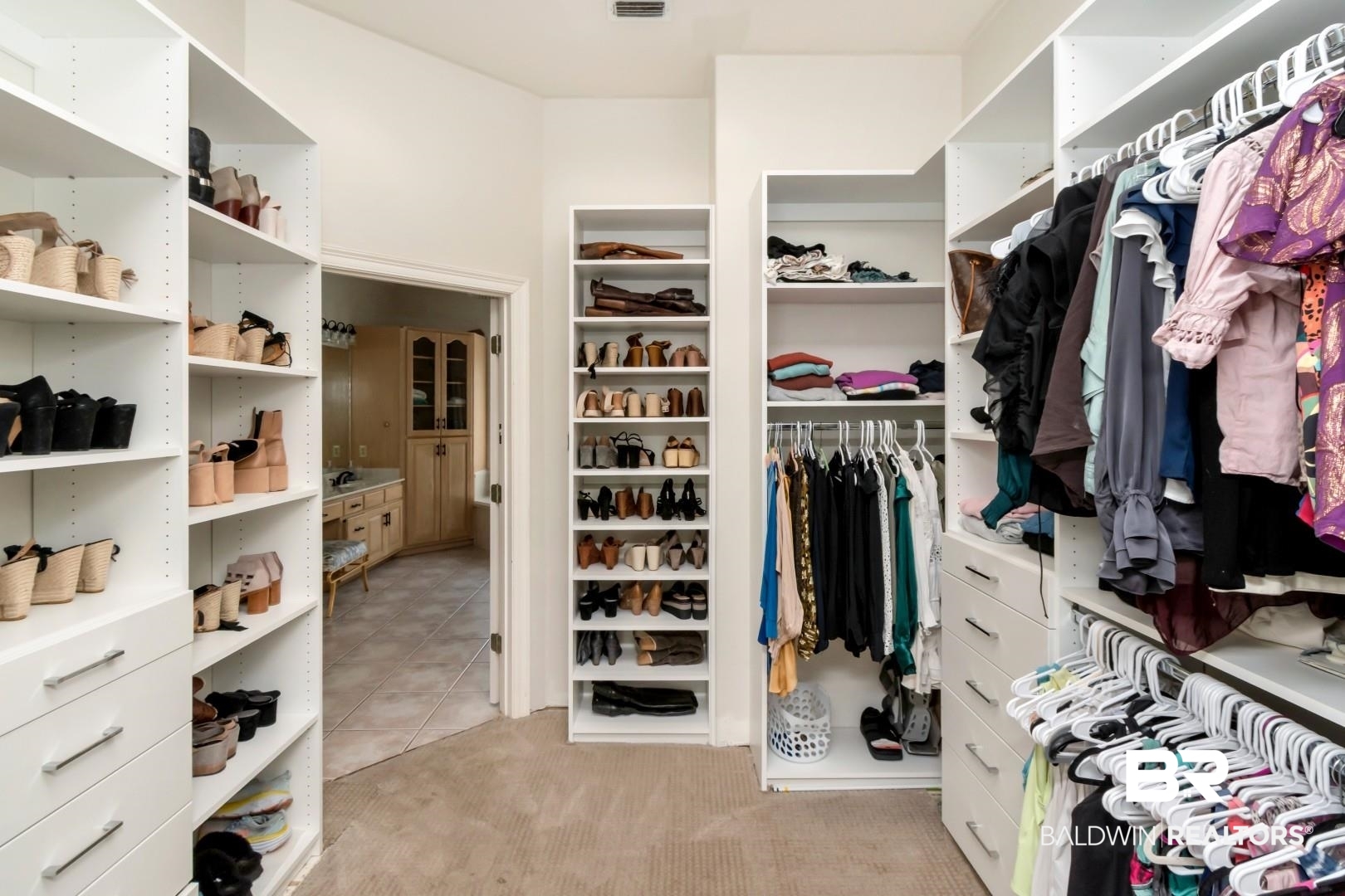 2640 Meadowlake Road Semmes, AL 36575 - Photo 29 of 55 Walk in closet with light colored carpet and light tile patterned floors
