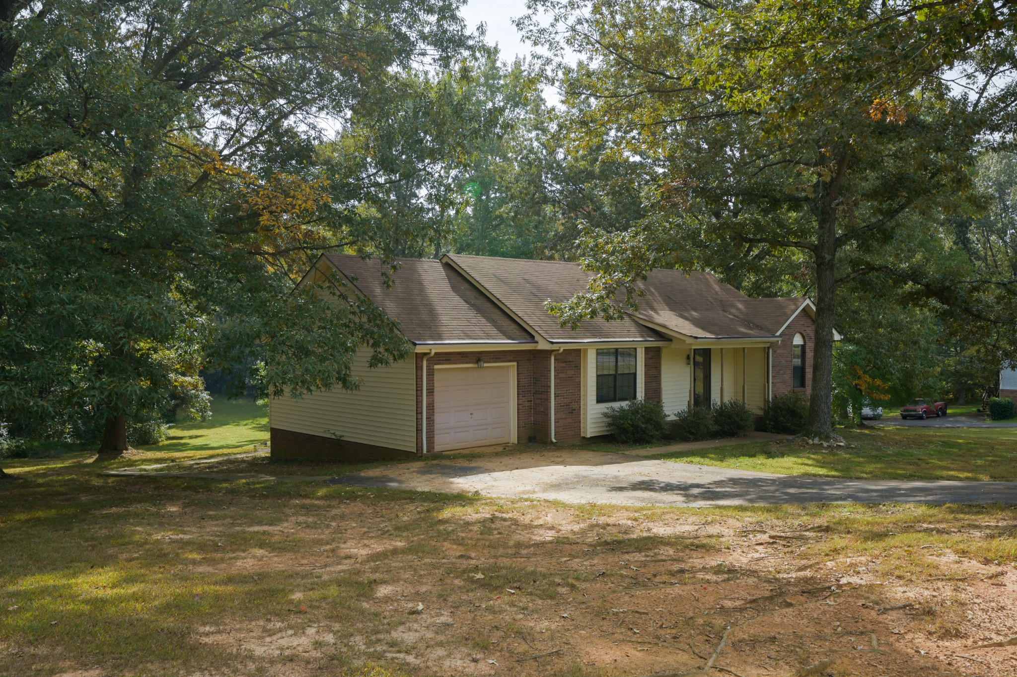2021 Jack Teasley Road Pleasant View, TN 37146 - Photo 1 of 17 a front view of a house with a garden