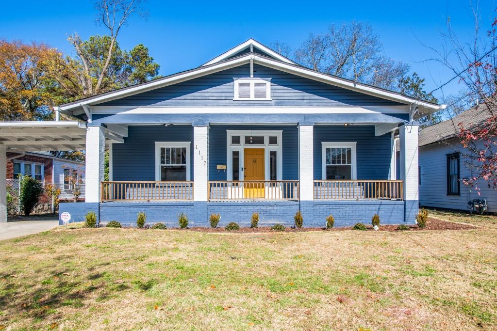 1117 Avon Avenue Southwest Atlanta, GA 30310 - Photo 1 of 1 a front view of a house with a yard