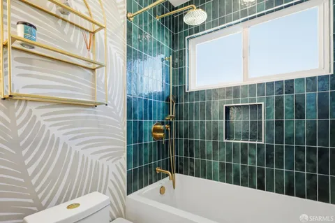 a bathroom with a bathtub and shower