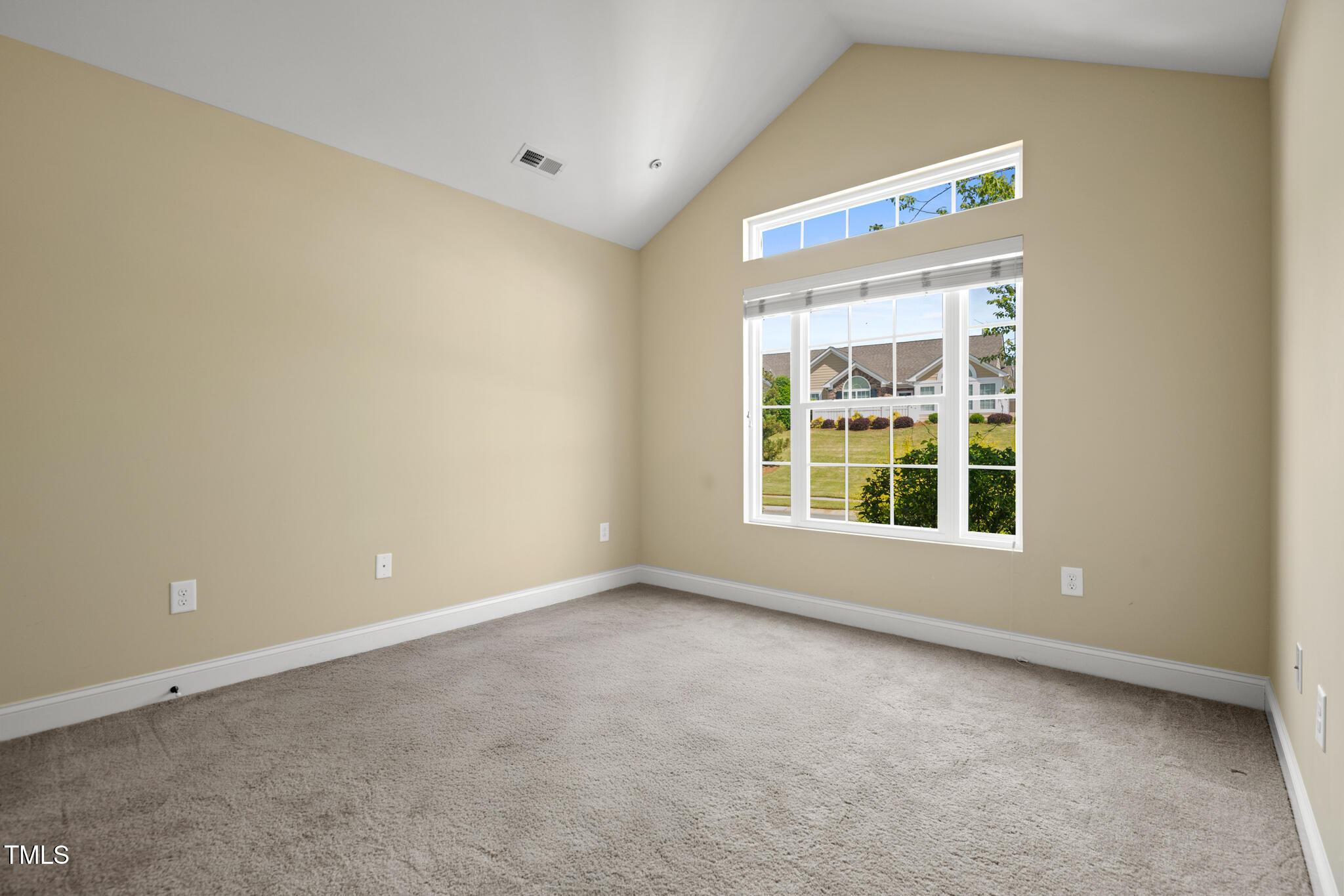 924 Carolina Bell Road Apex, NC 27502 - Photo 26 of 35 Guest bedroom with vaulted ceiling