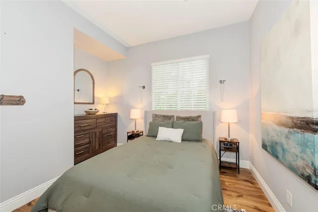 a bedroom with a bed and a dresser