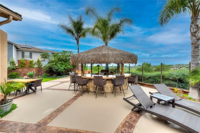 a view of a backyard with sitting area