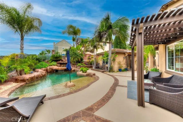 a view of a swimming pool with a patio