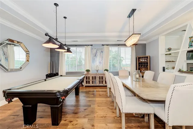a living room with furniture a table and a chandelier