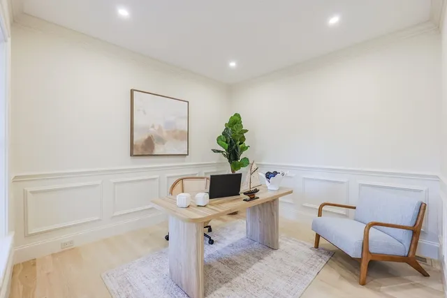 a view of entryway dining room and hall with wooden floor