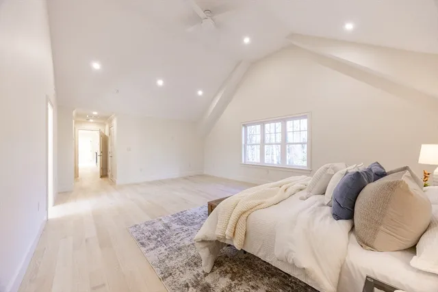 a spacious bathroom with a double vanity sink a mirror and a bathtub