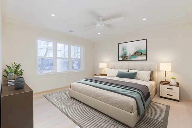 a bedroom with a large bed and a couch