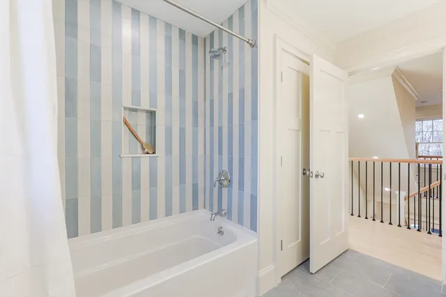 a bathroom with a double vanity sink toilet and a mirror