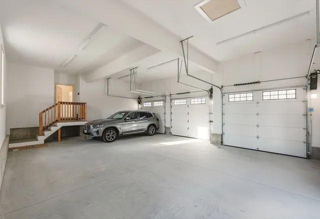 a view of a house with potted plants and couches