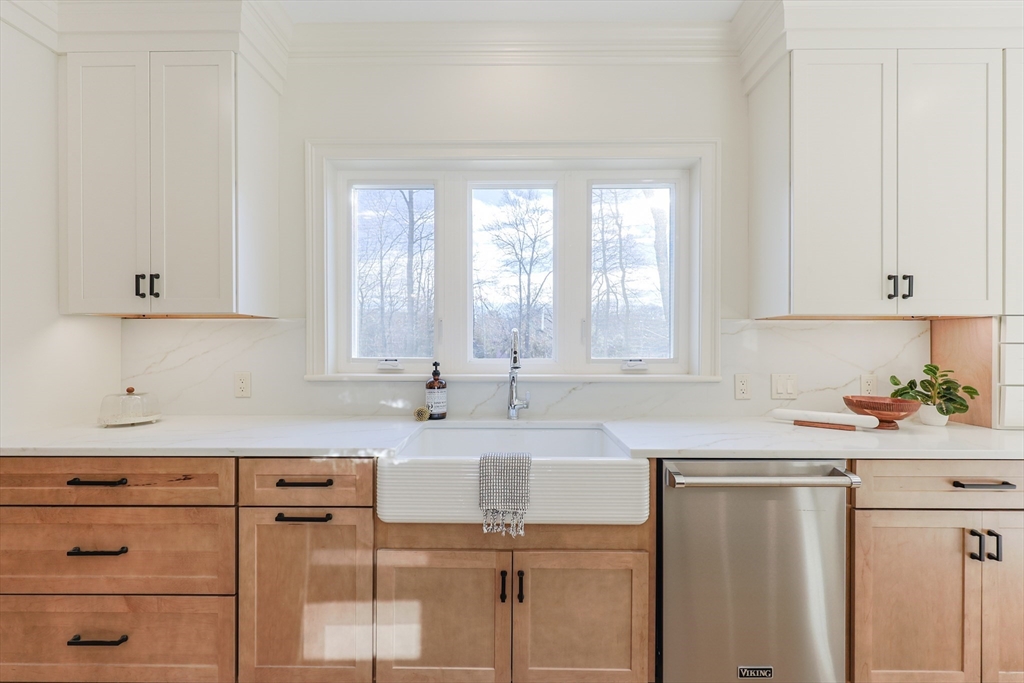 54 Woodland Road Scituate, MA 02066 - Photo 3 of 30 a kitchen with a sink window and cabinets