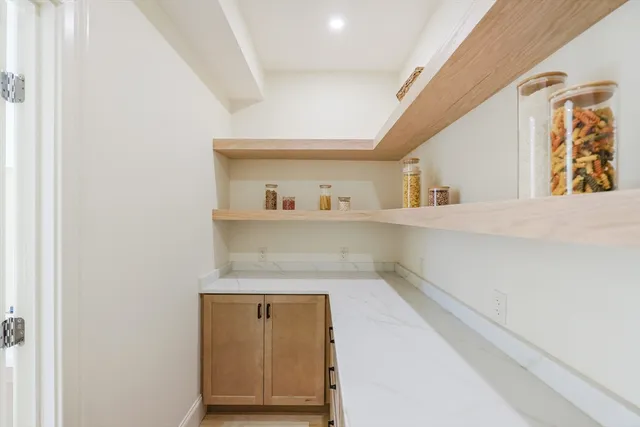 a kitchen with a stove a refrigerator and a sink