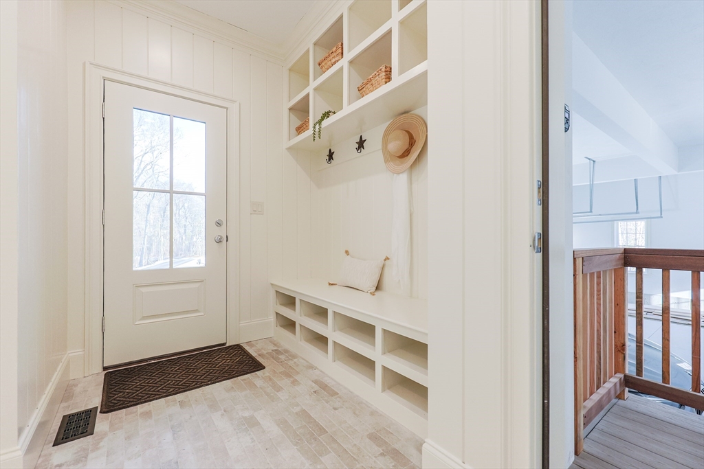 54 Woodland Road Scituate, MA 02066 - Photo 6 of 30 a view of a hallway with windows