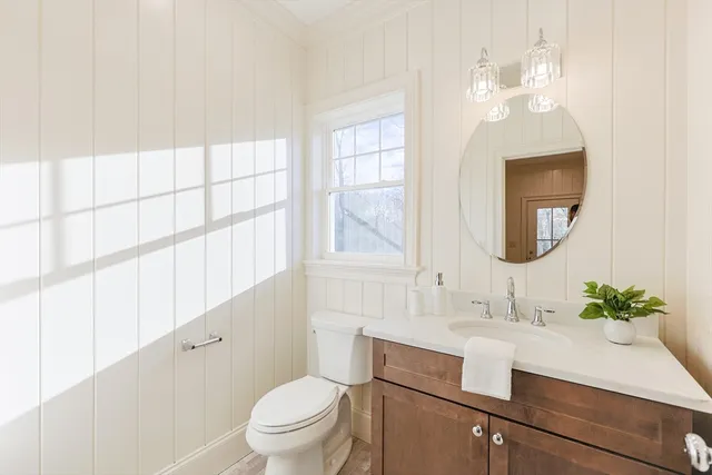 a dining room with furniture and a large window