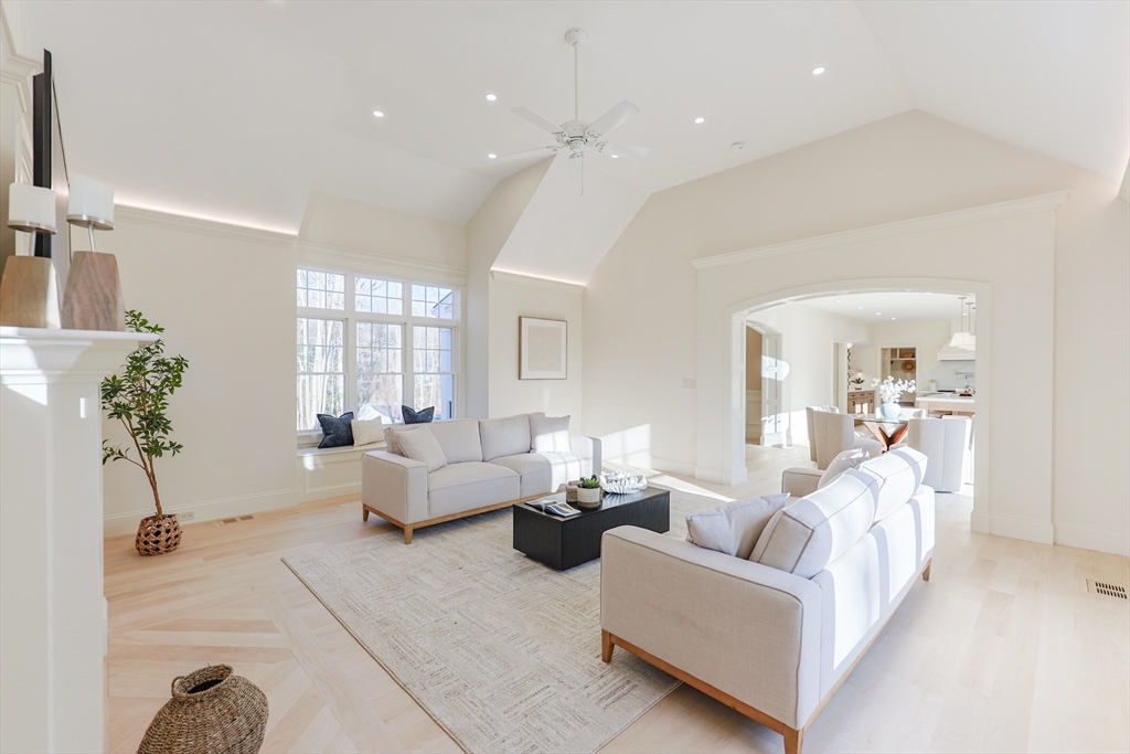 54 Woodland Road Scituate, MA 02066 - Photo 10 of 30 a living room with furniture and a chandelier