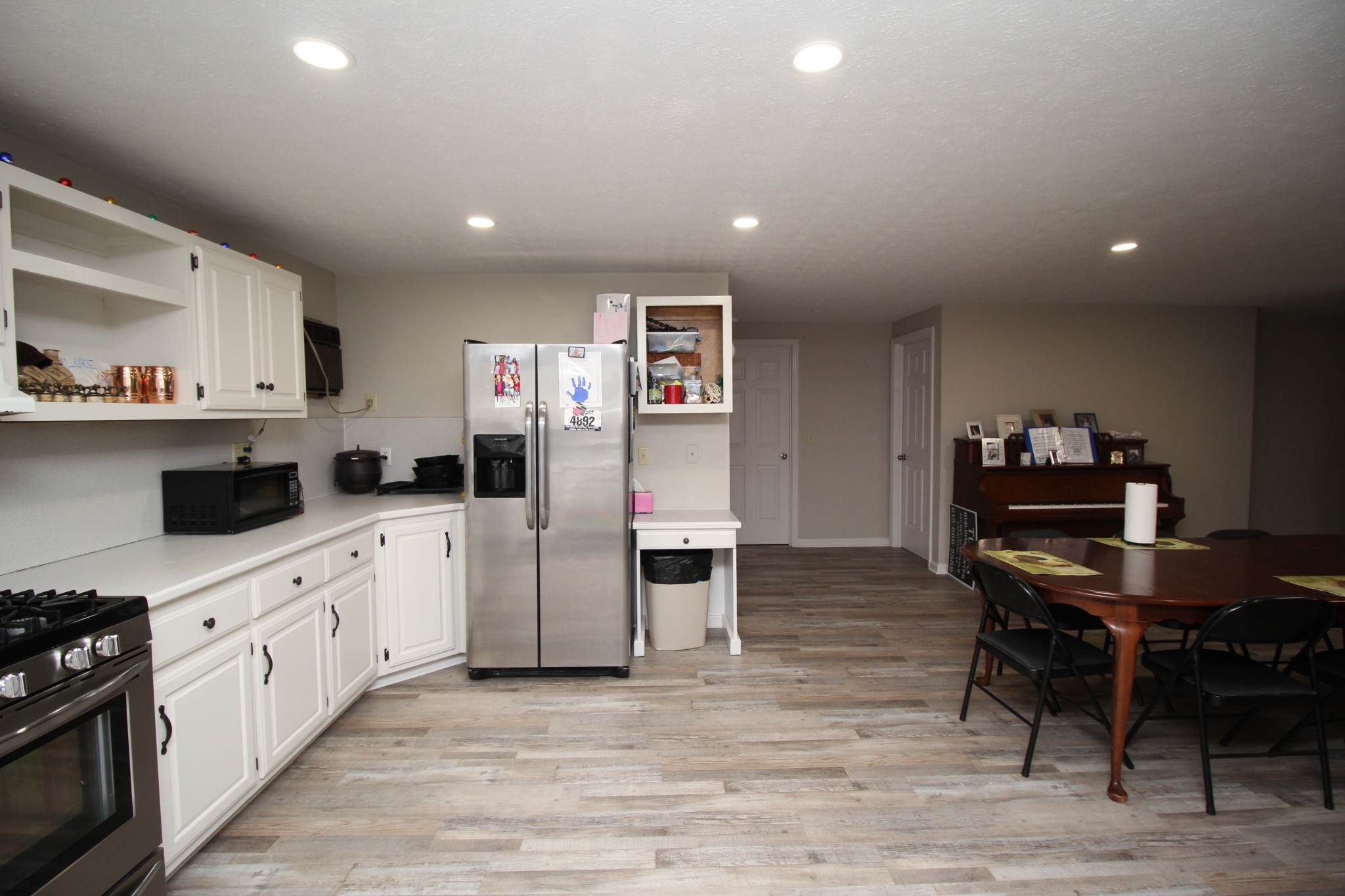 1270 Dotson Road Lafayette, TN 37083 - Photo 4 of 31 a kitchen with cabinets and wooden floor