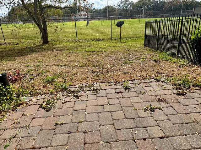 a view of a yard with a house