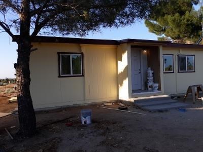 9126 Manada Road Phelan, CA 92371 - Photo 1 of 1 a front view of a house with a yard