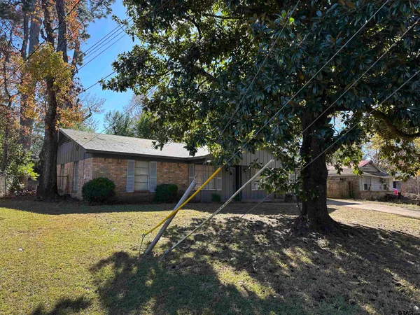 a view of a house with a tree