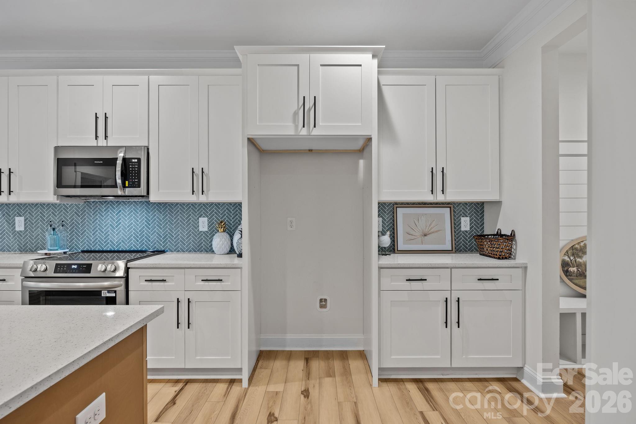 1030 Gibson Road Salisbury, NC 28147 - Photo 18 of 47 a kitchen with white cabinets and appliances