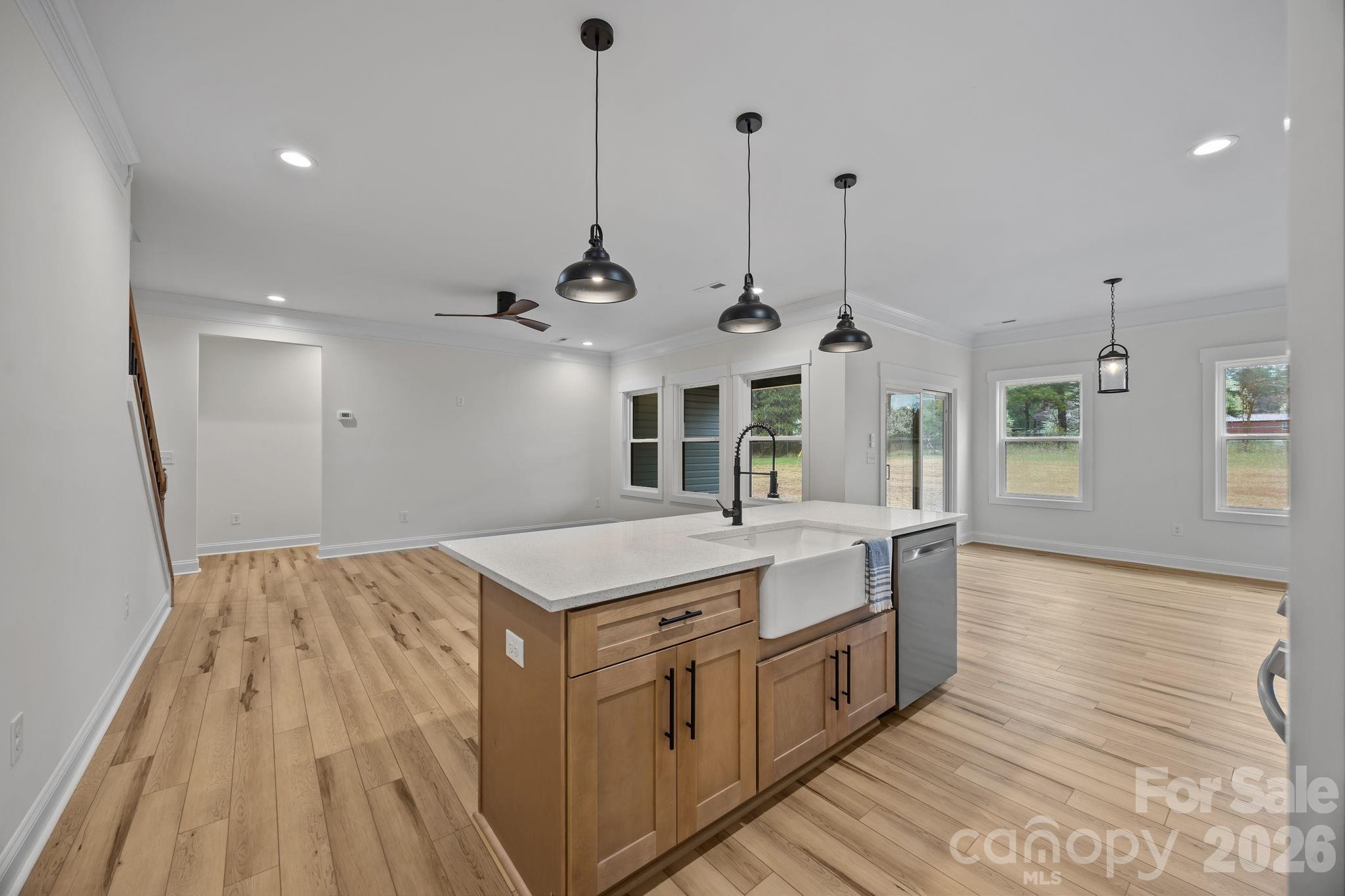 1030 Gibson Road Salisbury, NC 28147 - Photo 23 of 46 a kitchen with a sink and wooden floor
