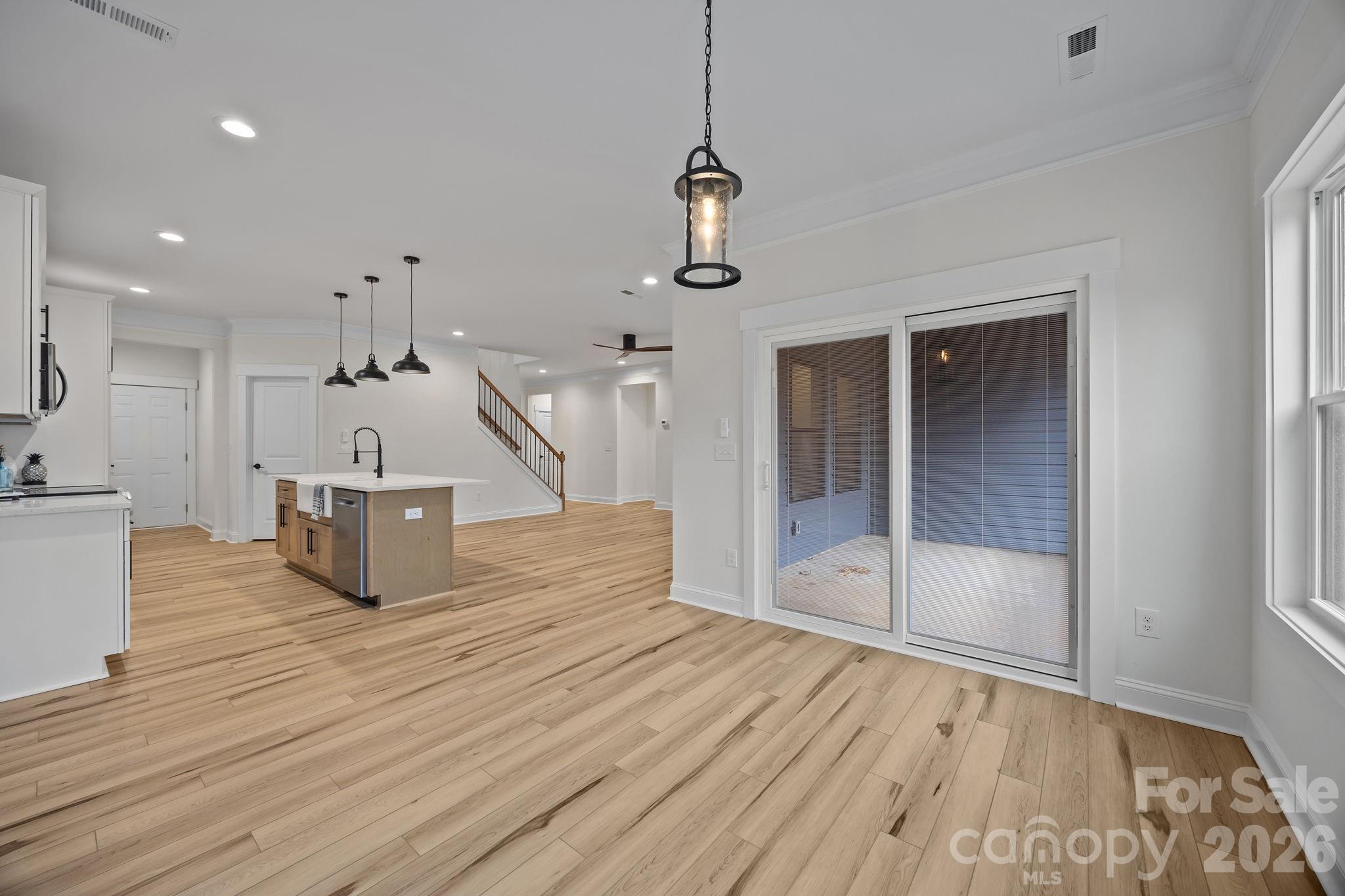 1030 Gibson Road Salisbury, NC 28147 - Photo 25 of 46 a room with wooden floor and staircase