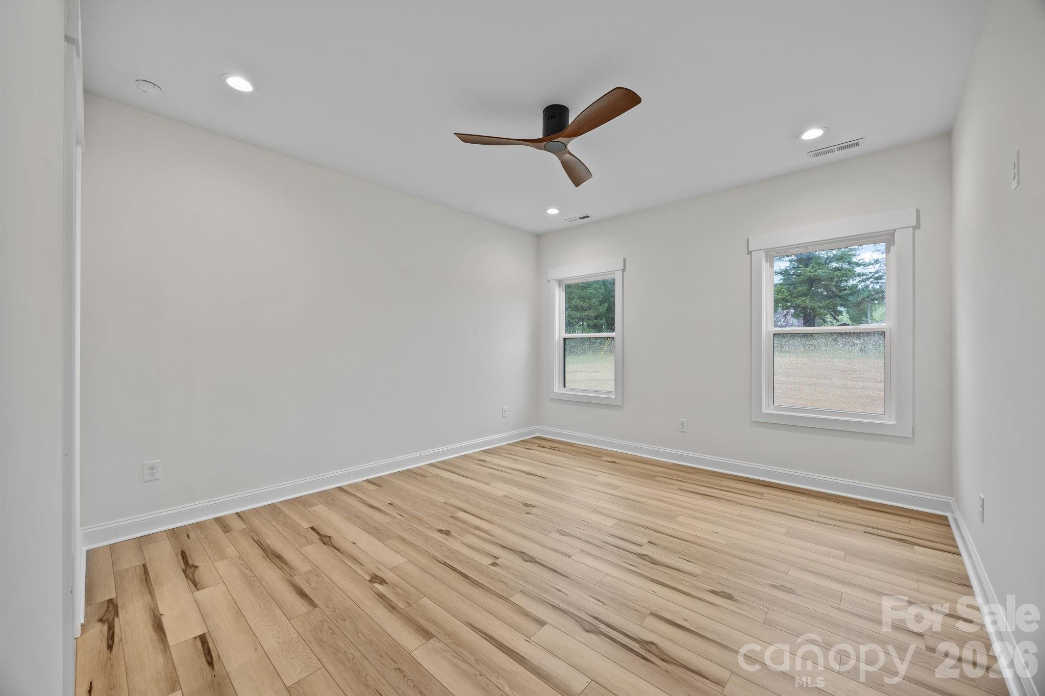 1030 Gibson Road Salisbury, NC 28147 - Photo 27 of 46 wooden floor in an empty room with a window