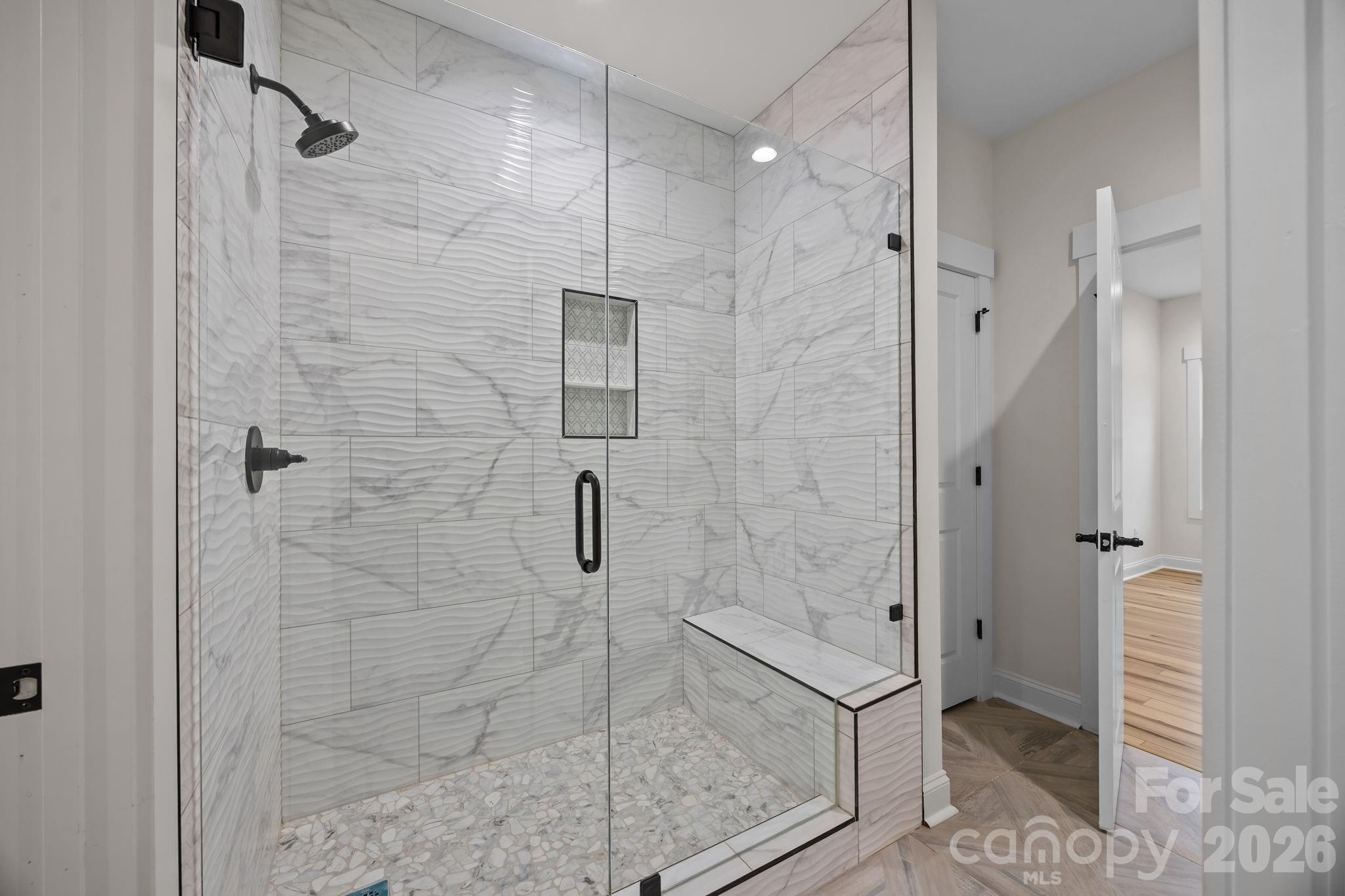 1030 Gibson Road Salisbury, NC 28147 - Photo 30 of 46 a bathroom with a shower and a glass door