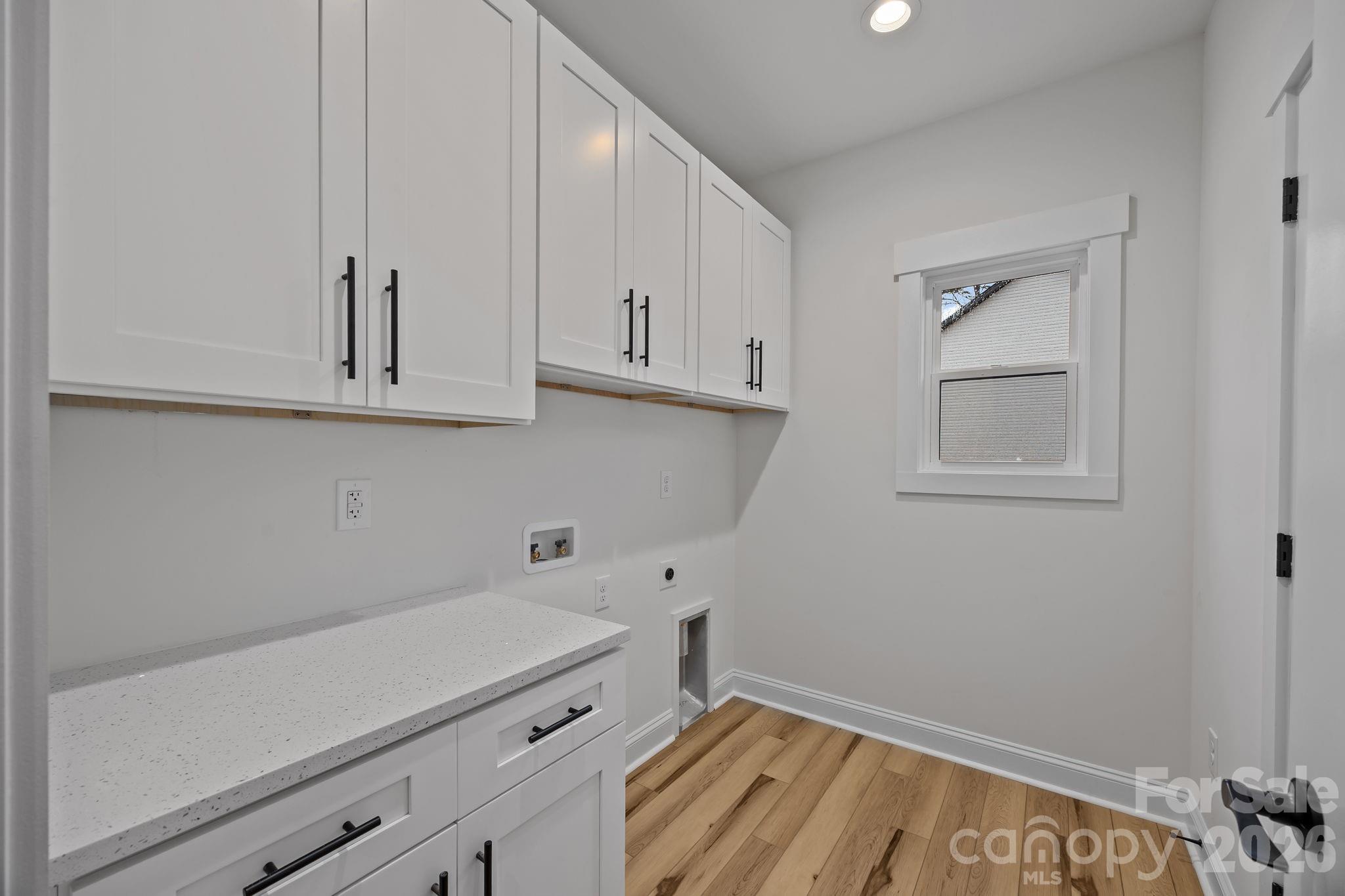 1030 Gibson Road Salisbury, NC 28147 - Photo 33 of 46 a view of cabinets with wooden floor
