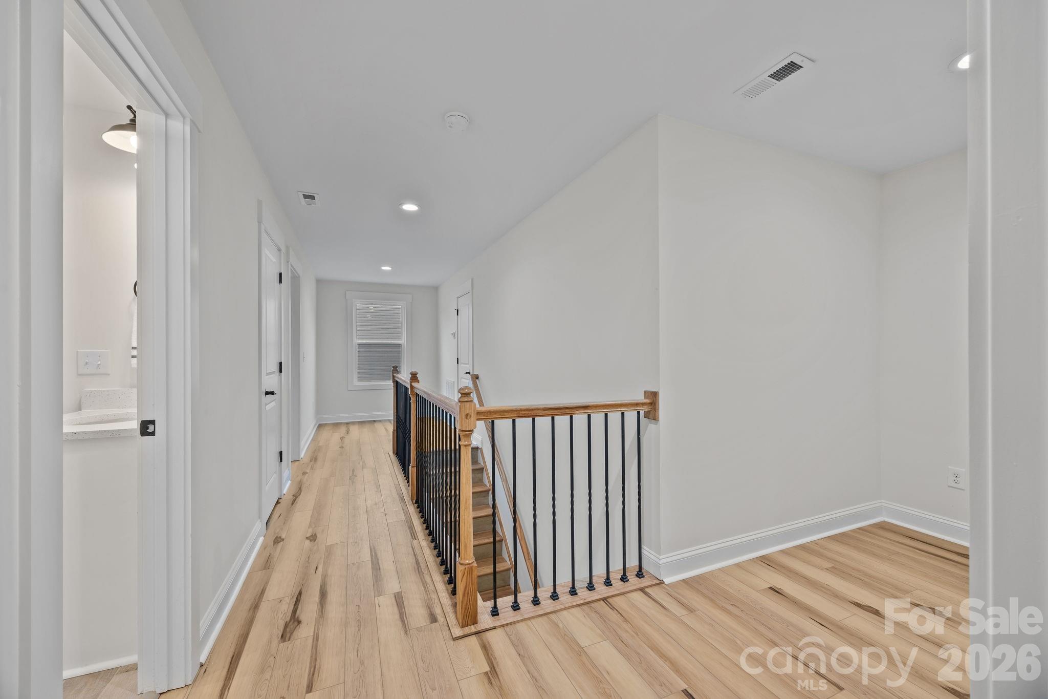 1030 Gibson Road Salisbury, NC 28147 - Photo 35 of 46 a view of a hallway with wooden floor