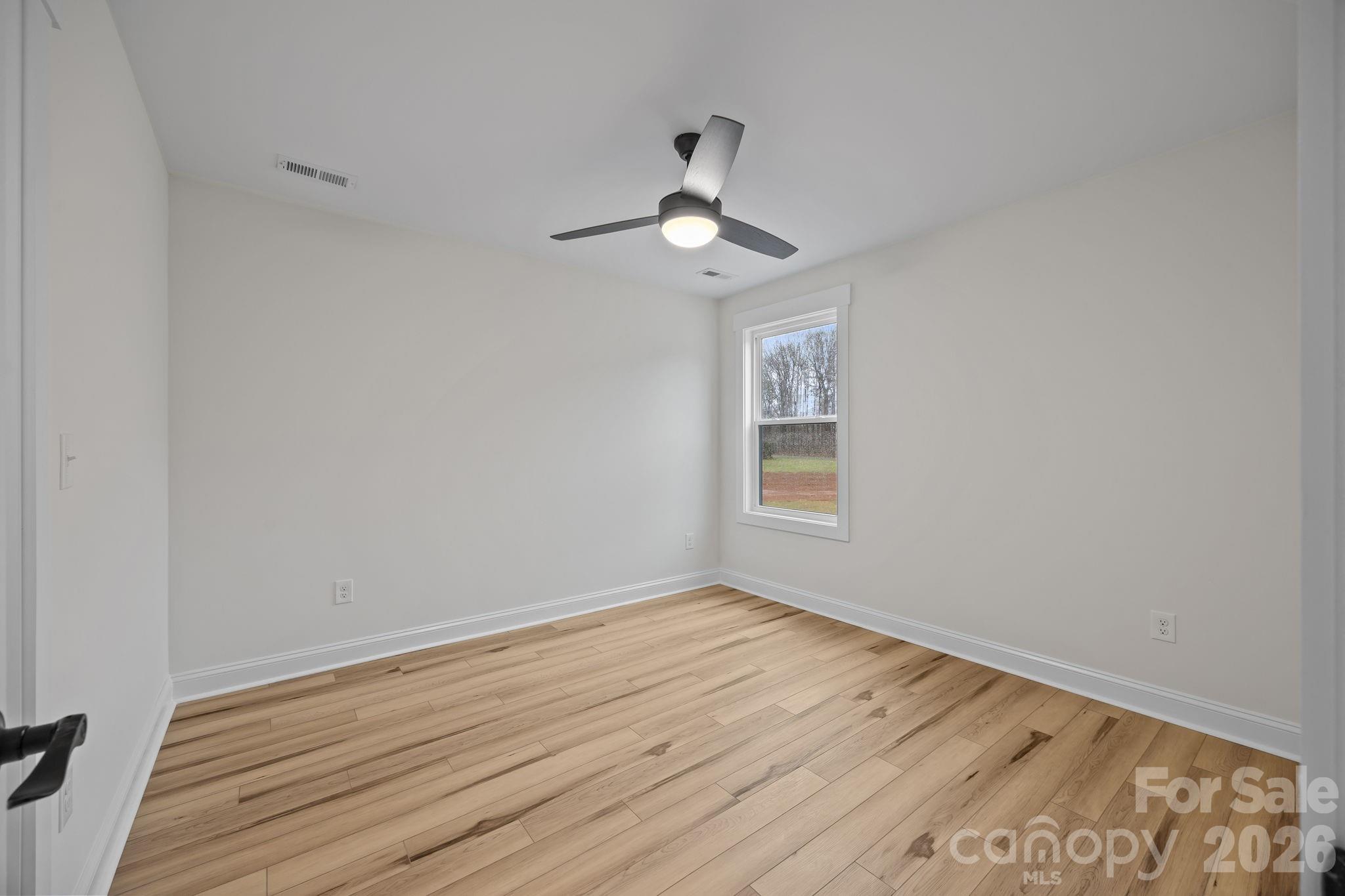 1030 Gibson Road Salisbury, NC 28147 - Photo 36 of 46 wooden floor in an empty room with a window