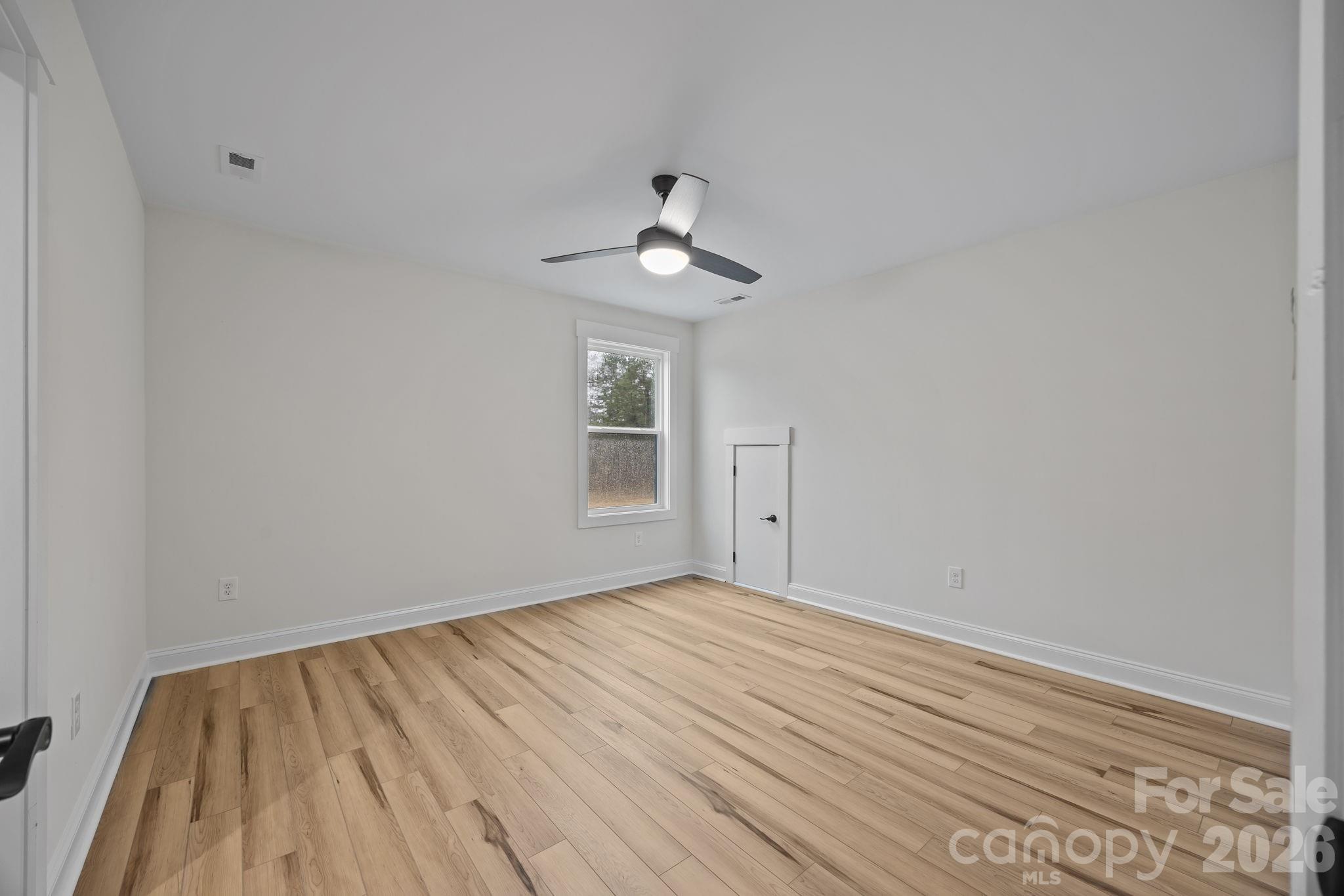 1030 Gibson Road Salisbury, NC 28147 - Photo 37 of 47 a view of empty room with wooden floor and fan