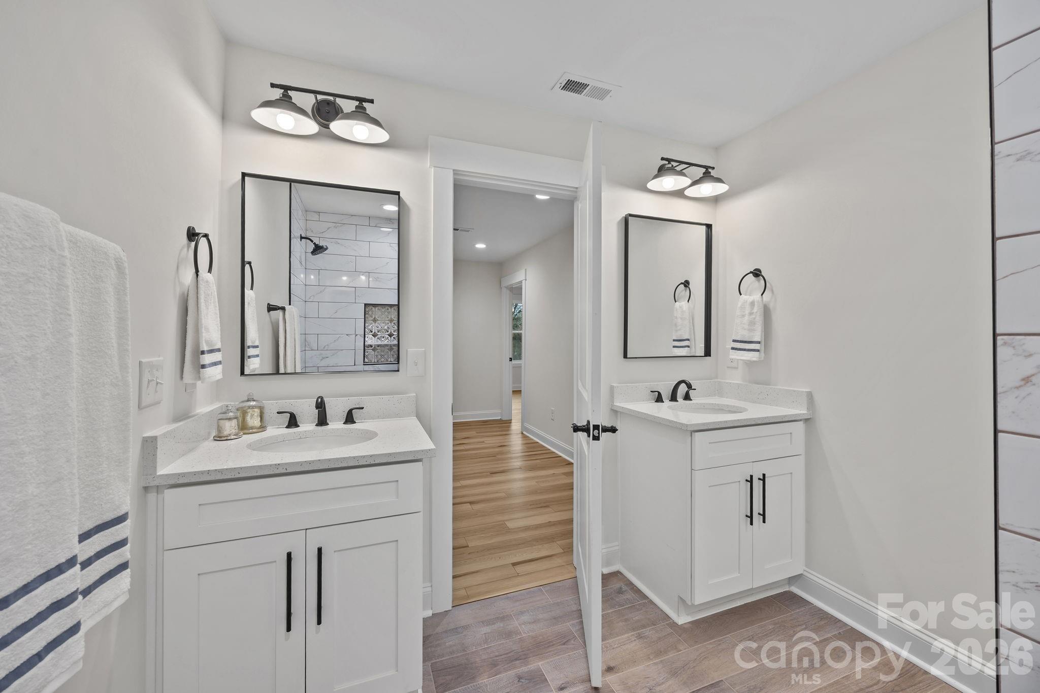 1030 Gibson Road Salisbury, NC 28147 - Photo 38 of 46 a spacious bathroom with a double vanity sink mirror and