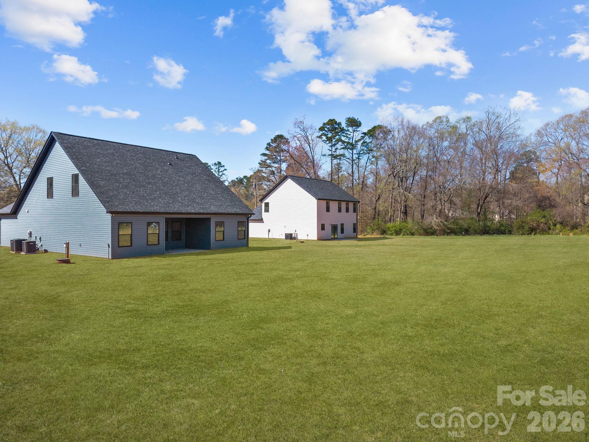 1030 Gibson Road Salisbury, NC 28147 - Photo 43 of 46 a front view of house with yard and trees in the background