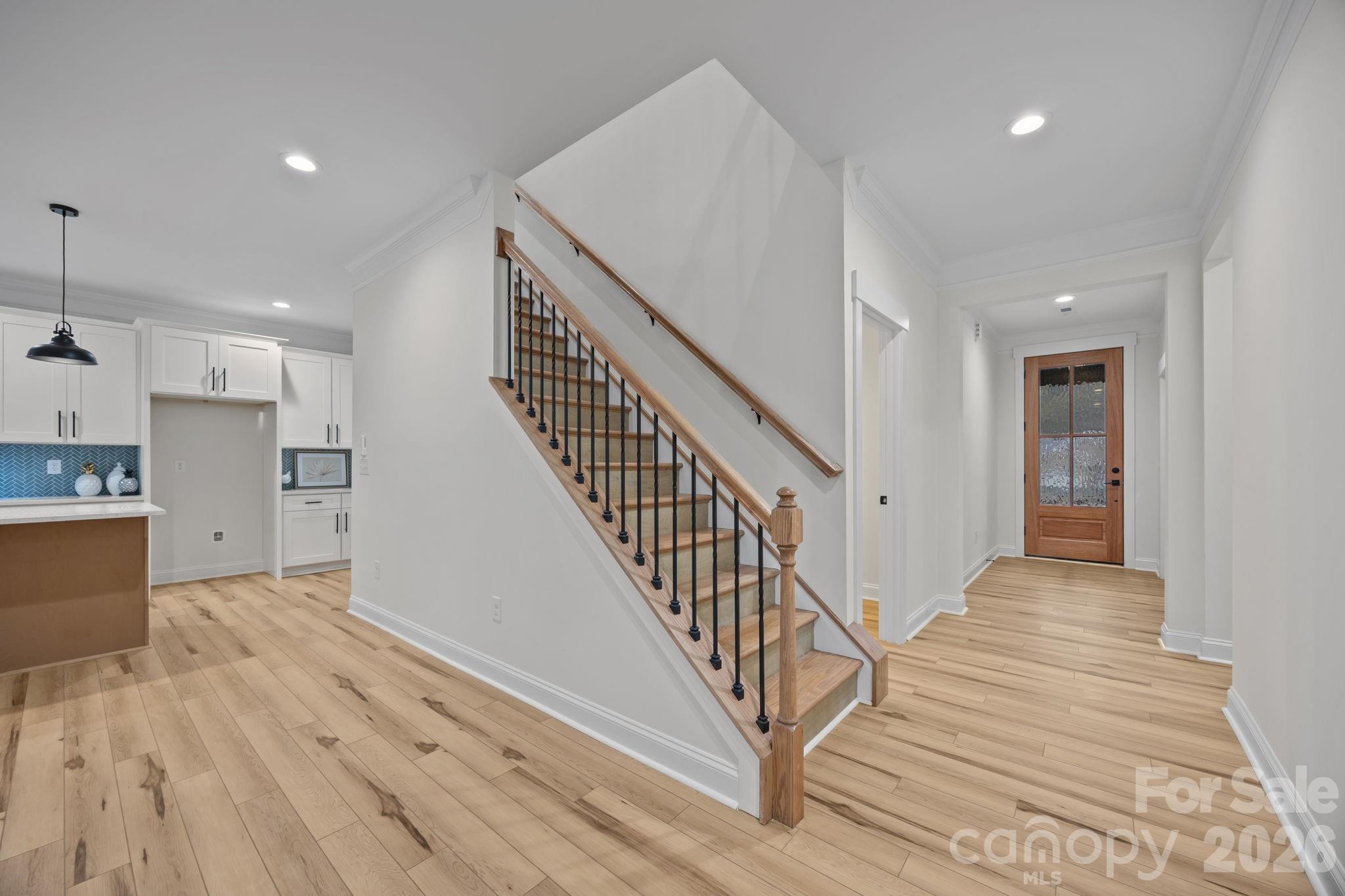 1030 Gibson Road Salisbury, NC 28147 - Photo 6 of 47 a view of a hallway with wooden floor and staircase