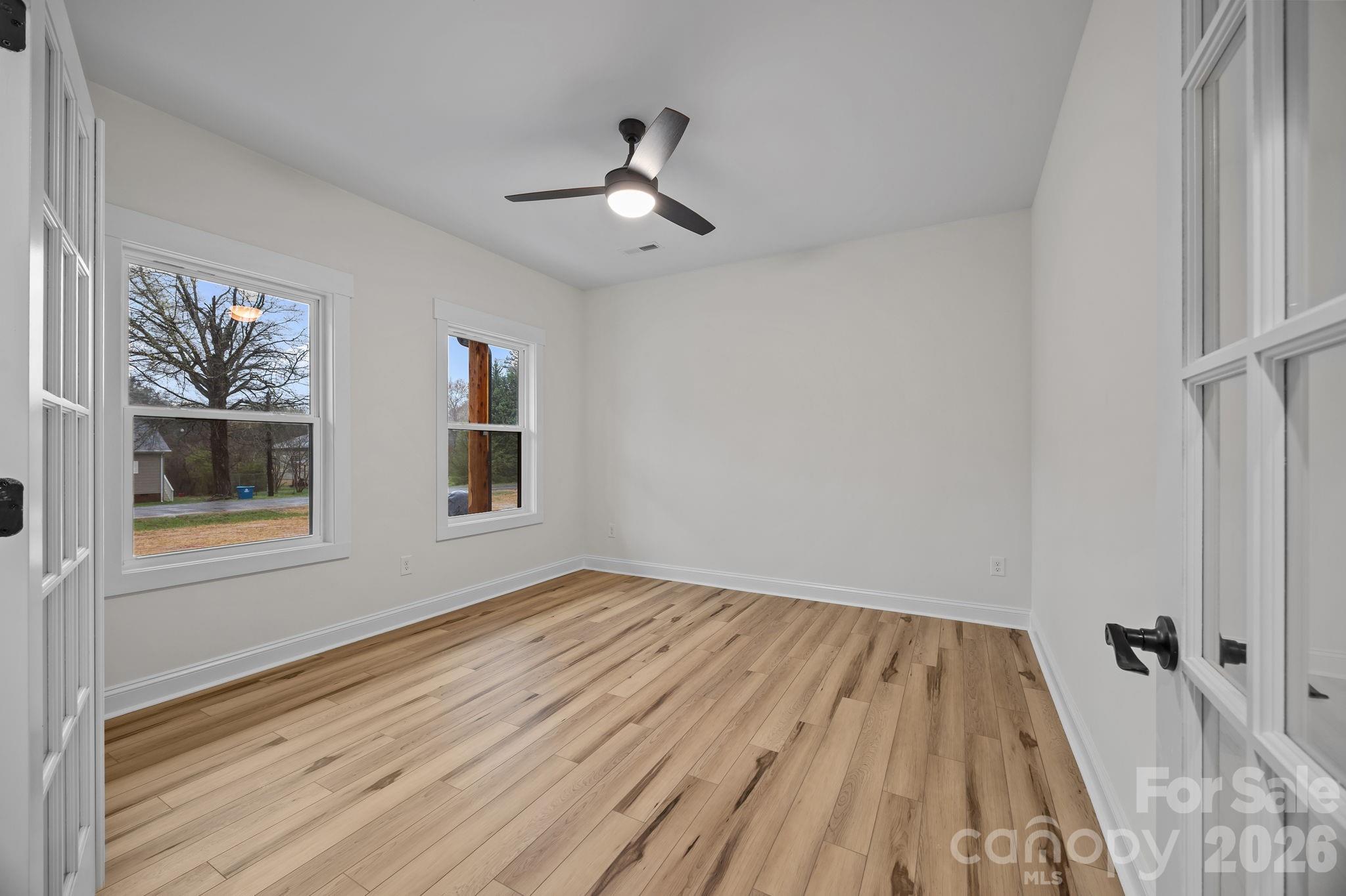 1030 Gibson Road Salisbury, NC 28147 - Photo 8 of 47 wooden floor in an empty room with a window