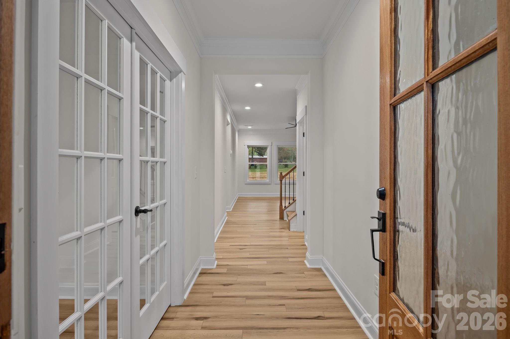 1030 Gibson Road Salisbury, NC 28147 - Photo 8 of 46 a view of a hallway with wooden floor and staircase